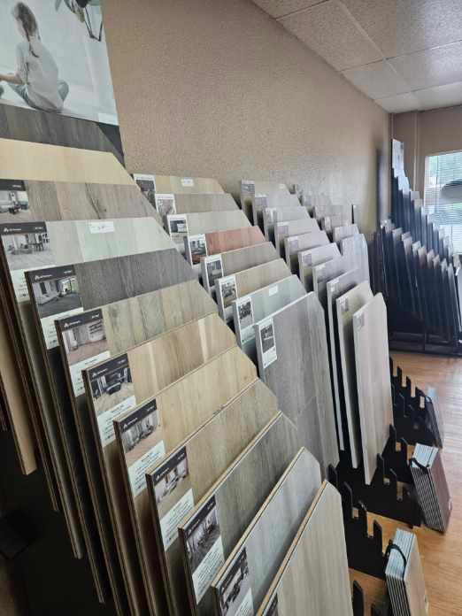 A display case filled with lots of different types of flooring in a store.