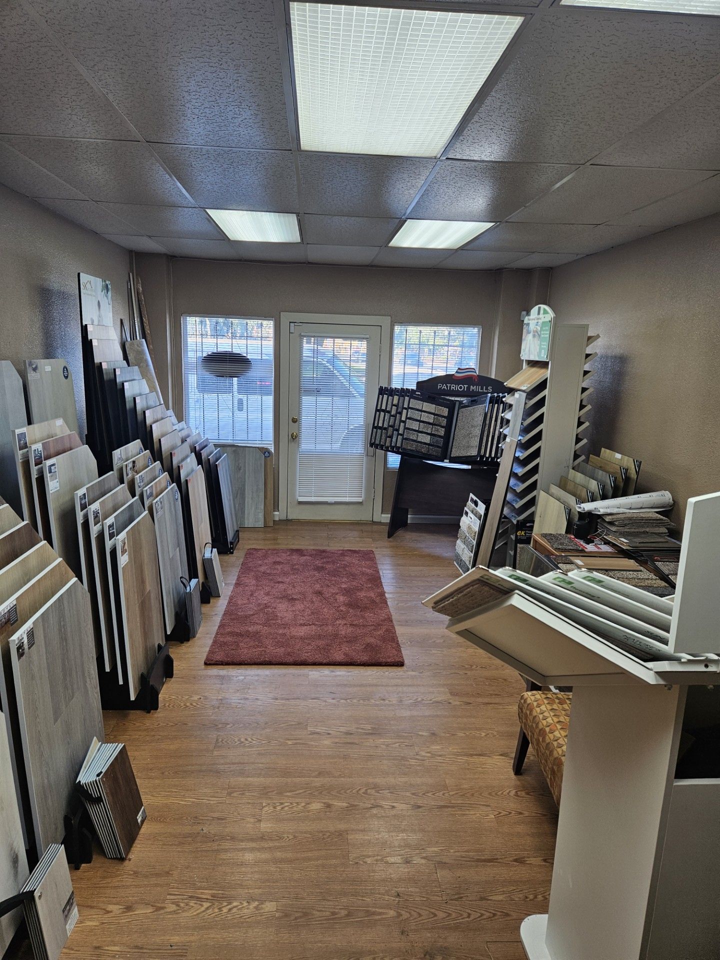 A room filled with lots of tiles and a rug.