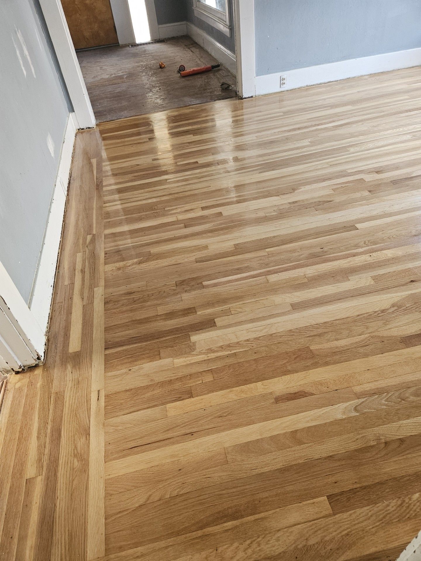 A close up of a wooden floor in a room.