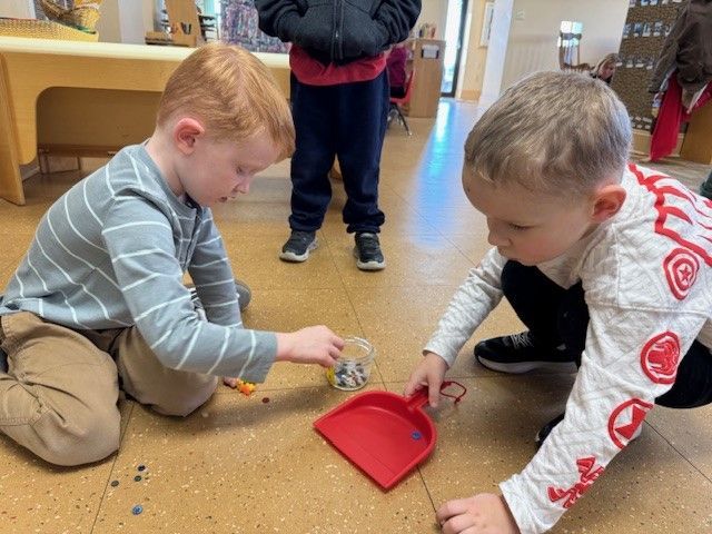 kids using dust pan