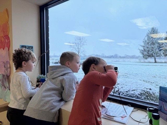 kids looking at snow
