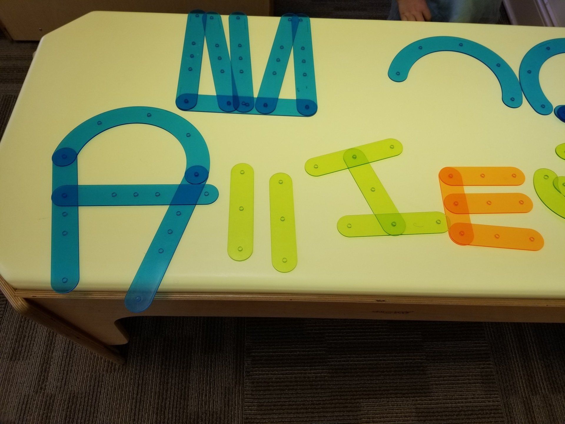 A table with a bunch of letters on it including a and e