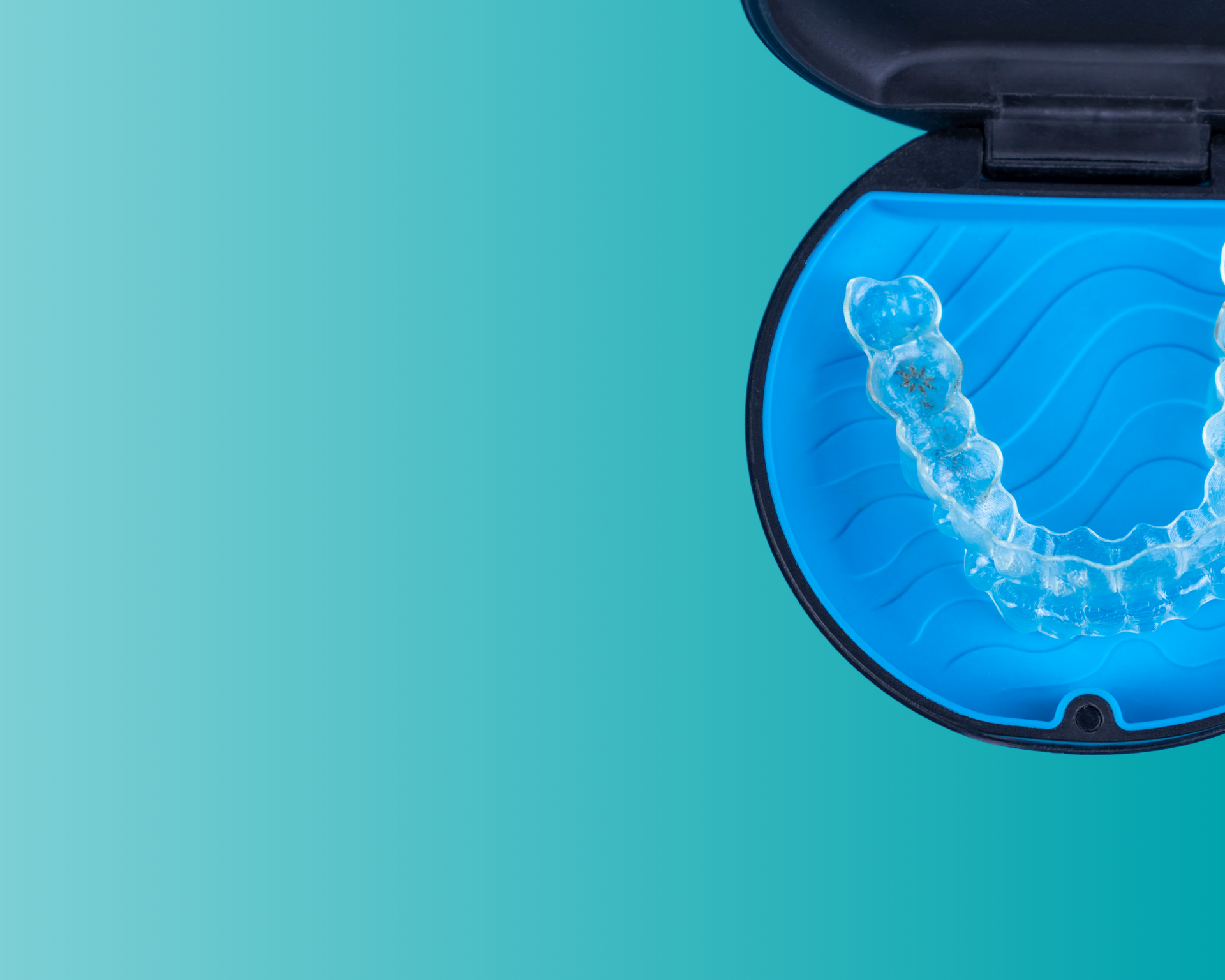 a close up of a mouth guard in a case on a blue background .