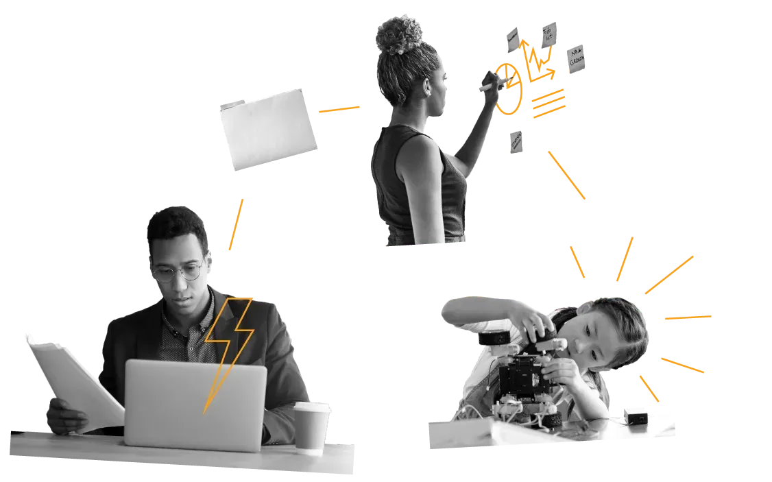 A man is sitting at a desk with a laptop and a woman is writing on a whiteboard.