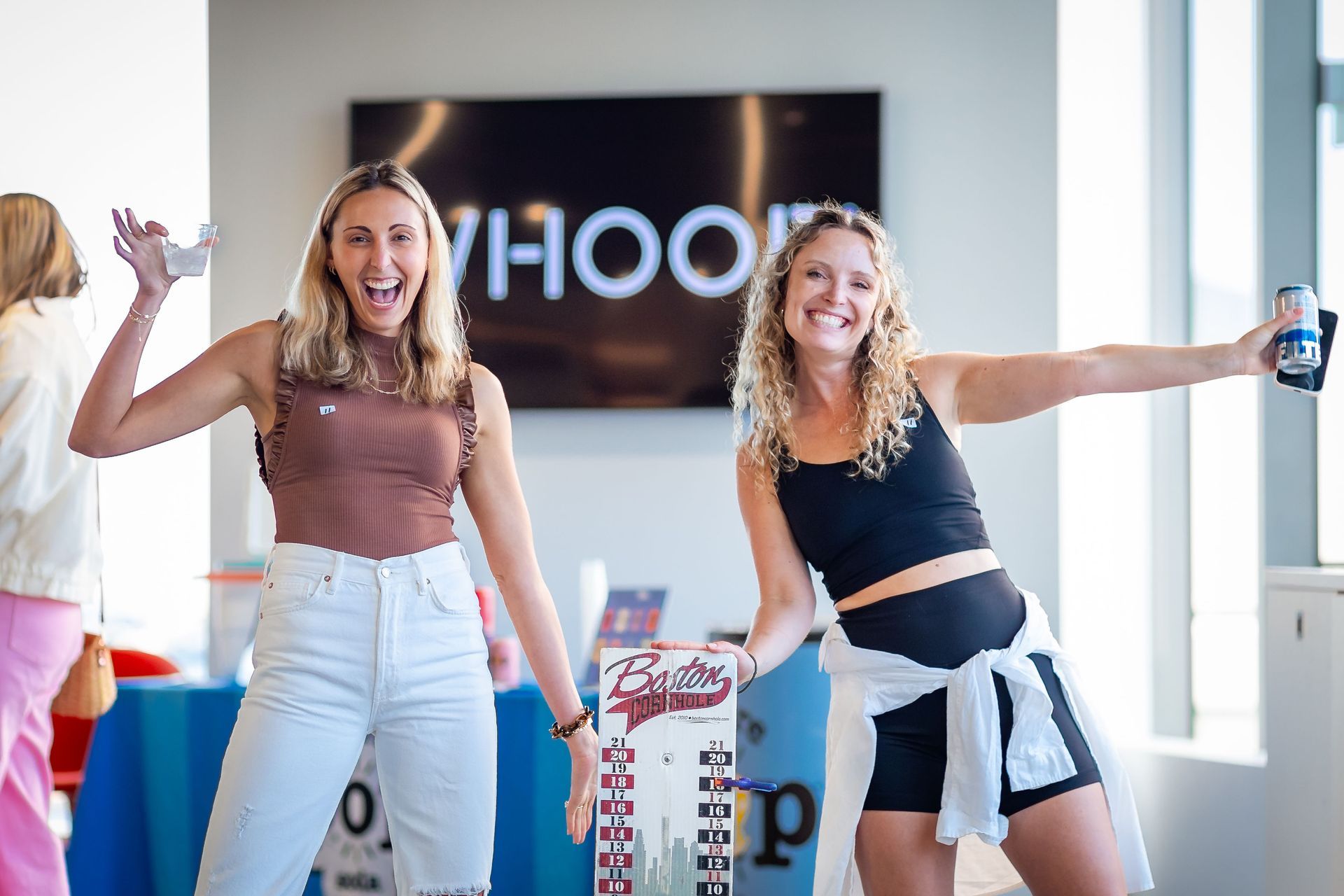 Two women are standing next to each other in a room.