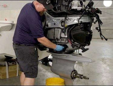 Outboard motor being serviced