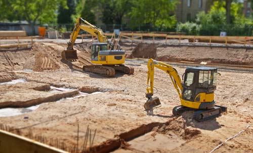 Earthmovers on excavation work