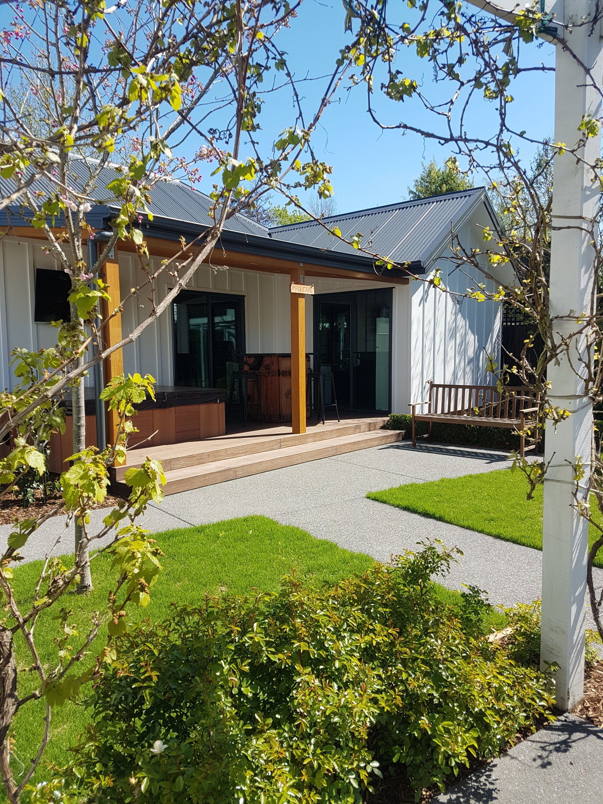 A house with a porch and a bench in front of it