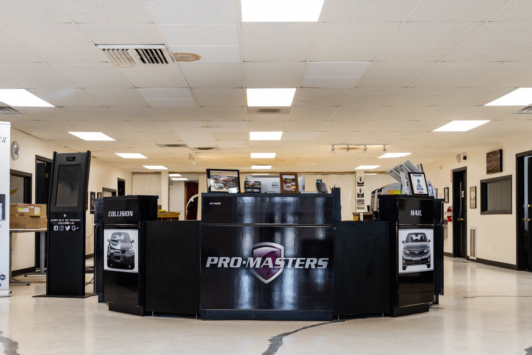 A large room with a pro masters counter in the middle.