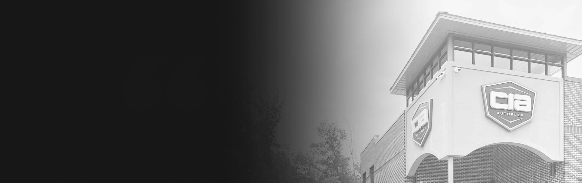 A black and white photo of a building | CIA Autoplex