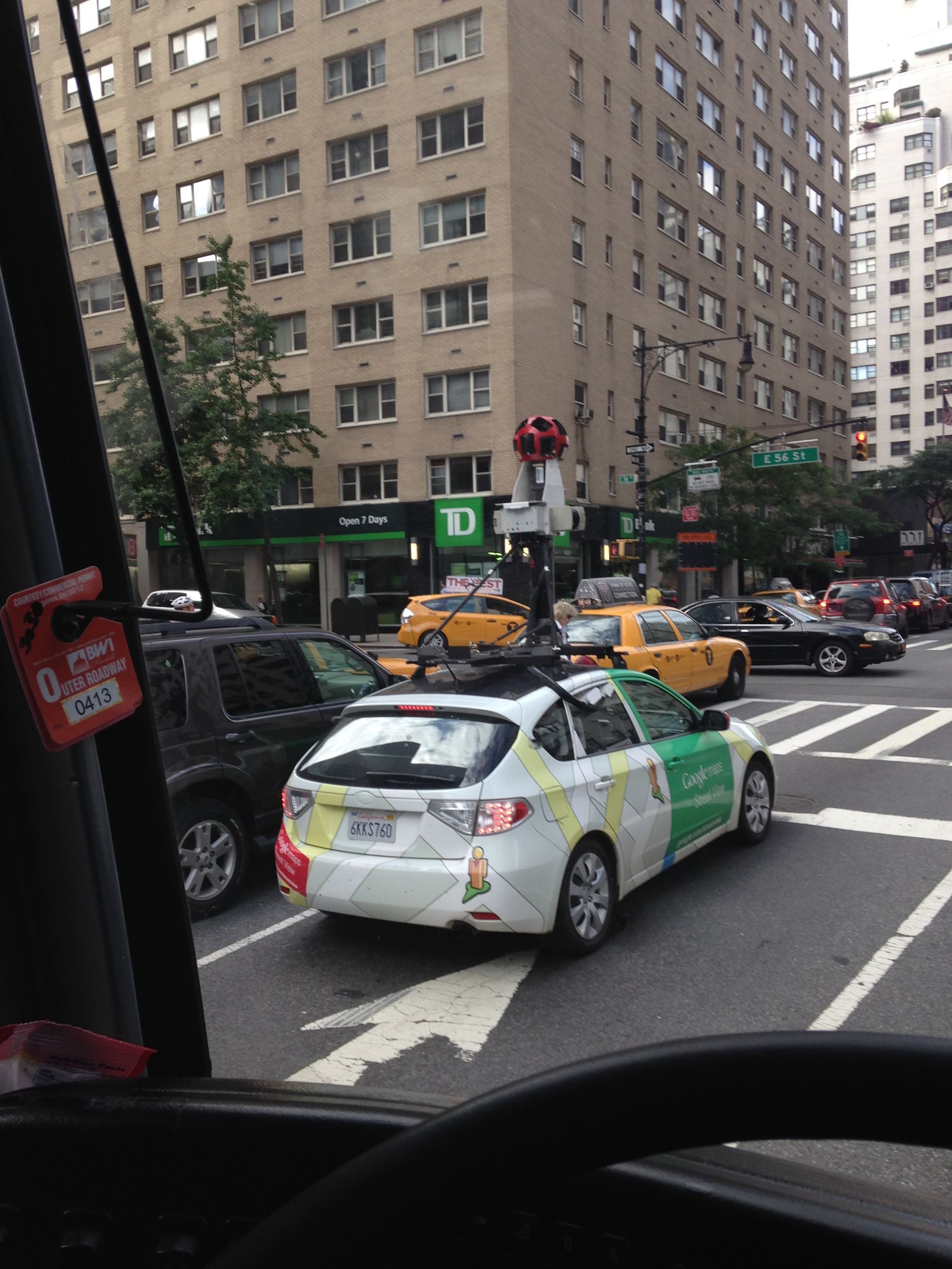 A google car is driving down a city street