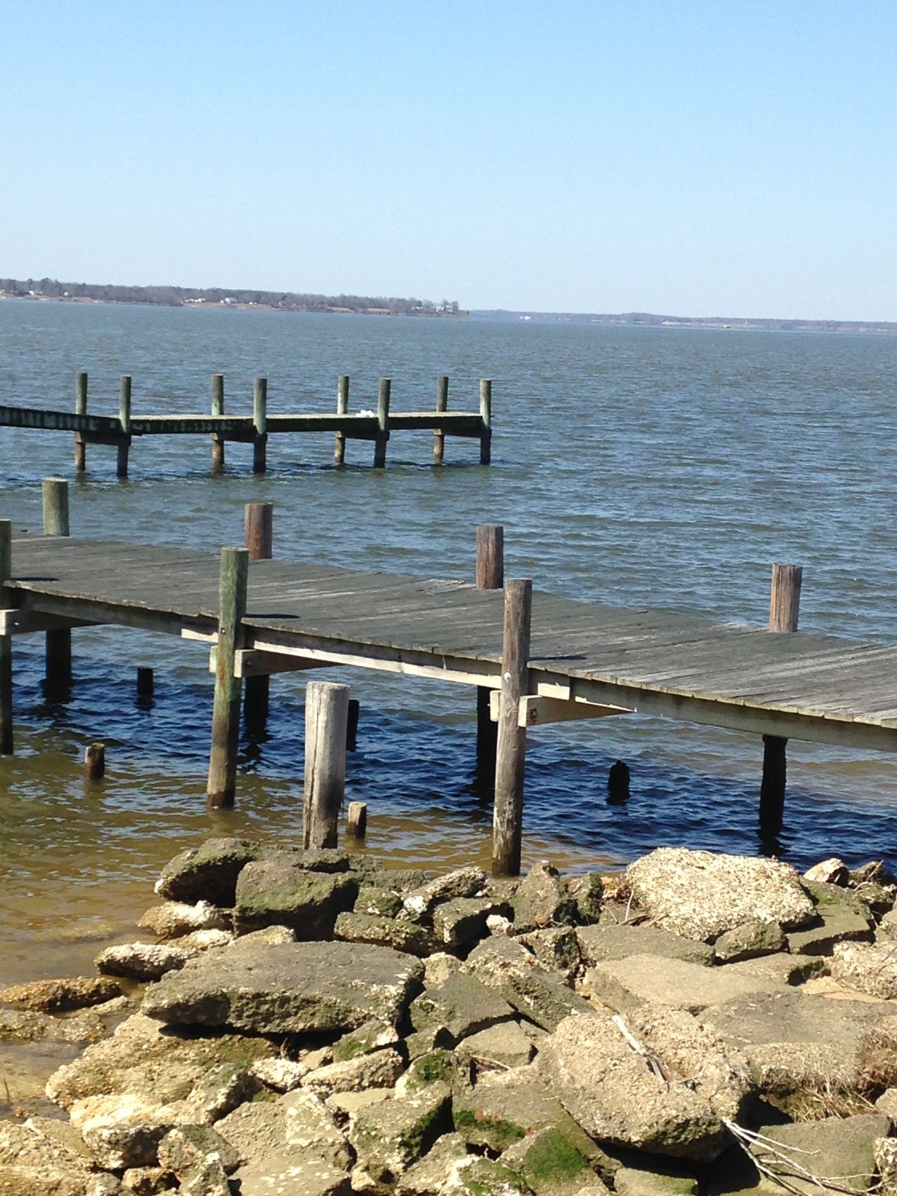 A wooden dock overlooking a large body of water