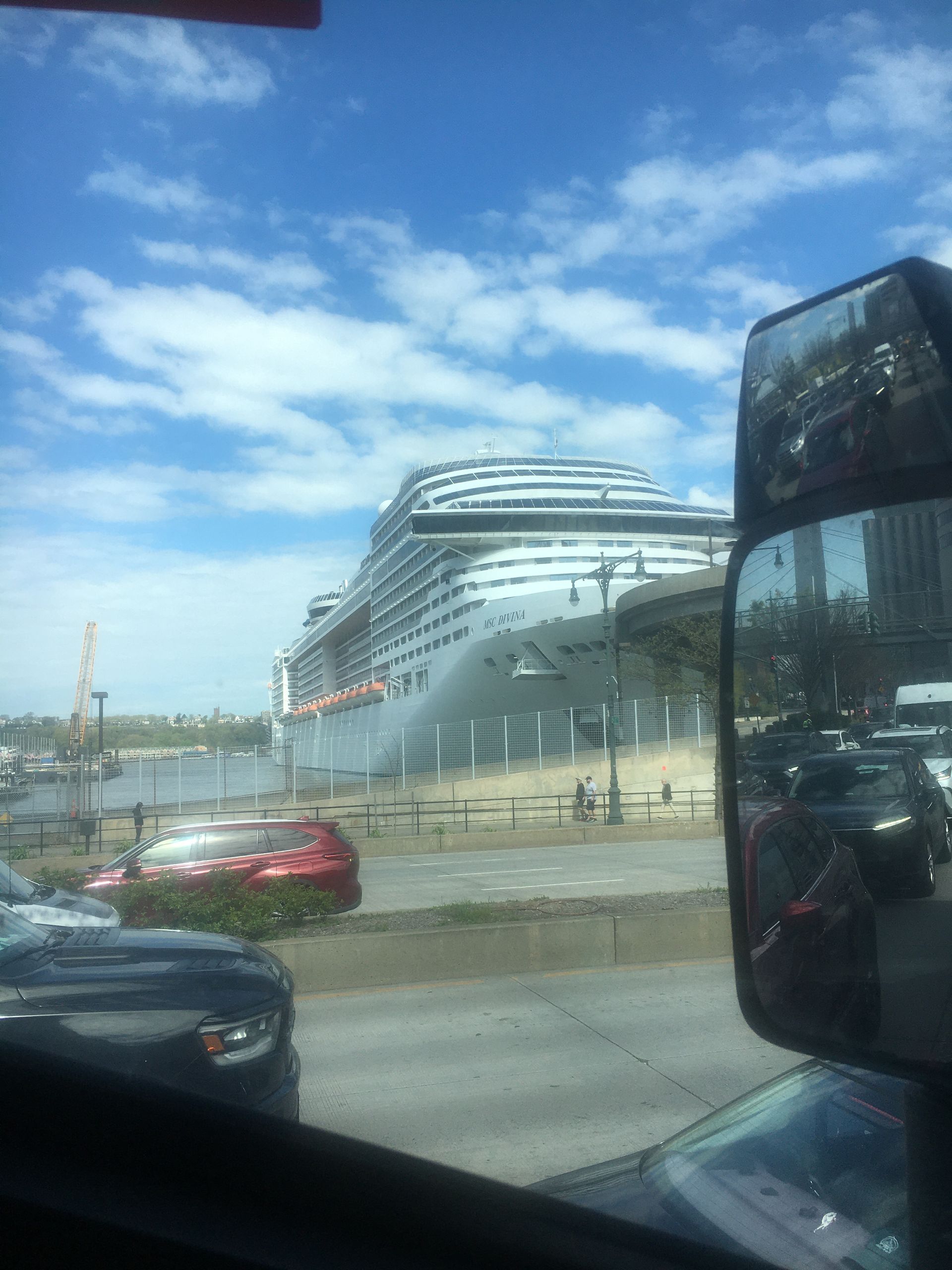A large cruise ship is docked in a harbor.