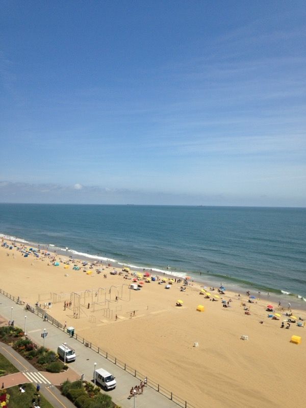 An aerial view of a beach with a lot of people on it