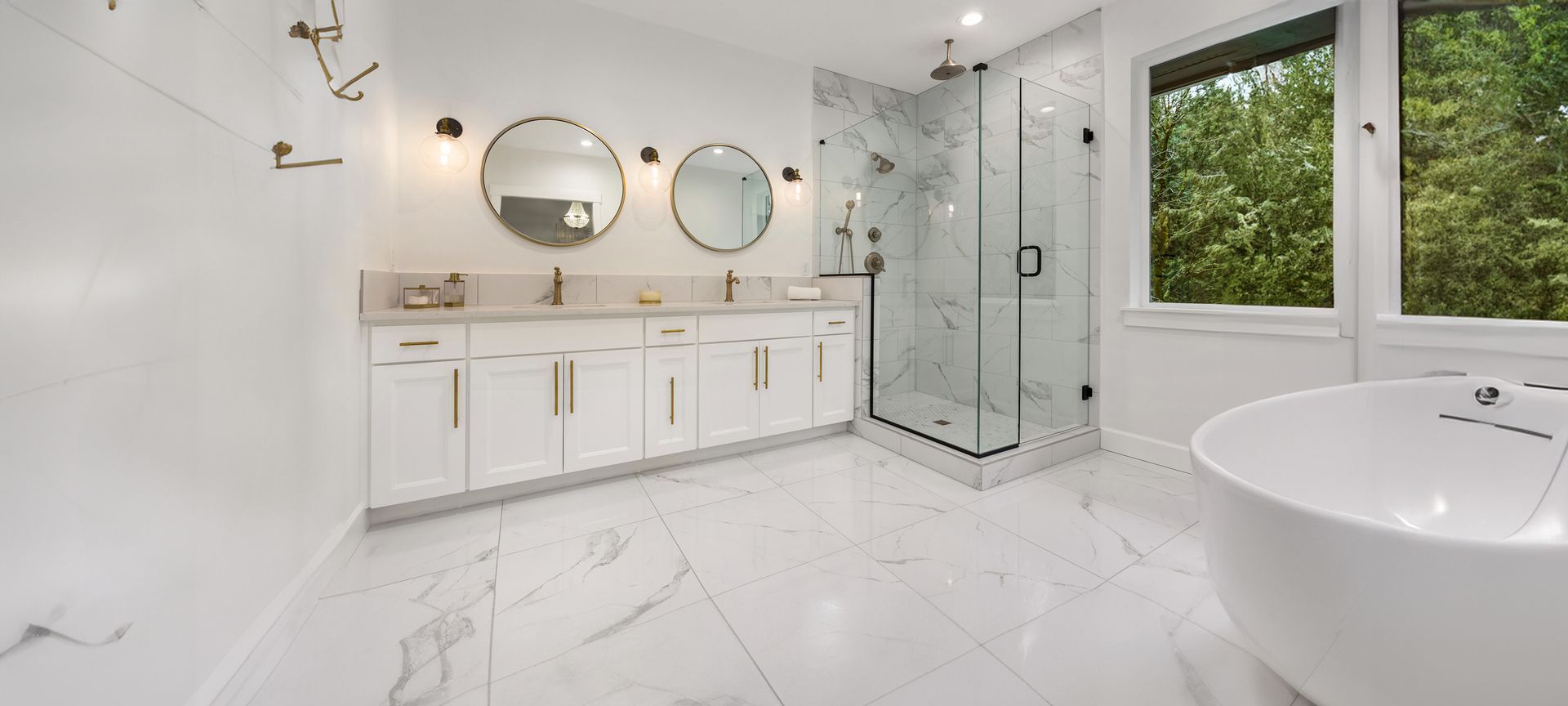 A bathroom with two sinks , a tub , a shower and a window.