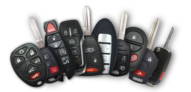 A collection of car keys with various button configurations and metal blades, arranged against a white background.