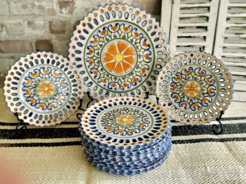A bunch of plates with a floral design on them