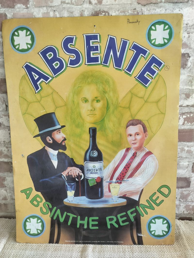 A sign that says absente absinthe refined on it