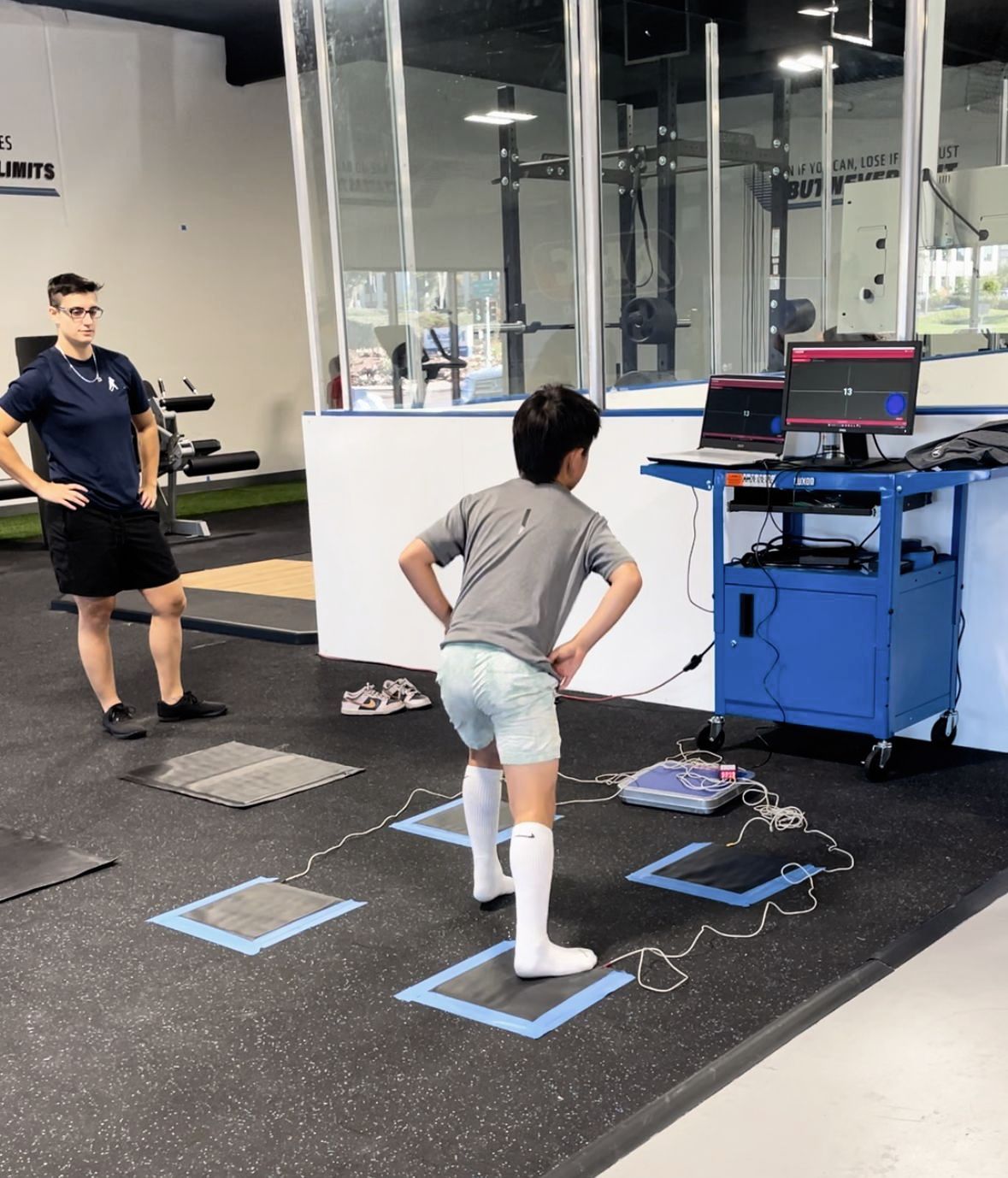 youth athlete performing a fitness diagnostic with coach