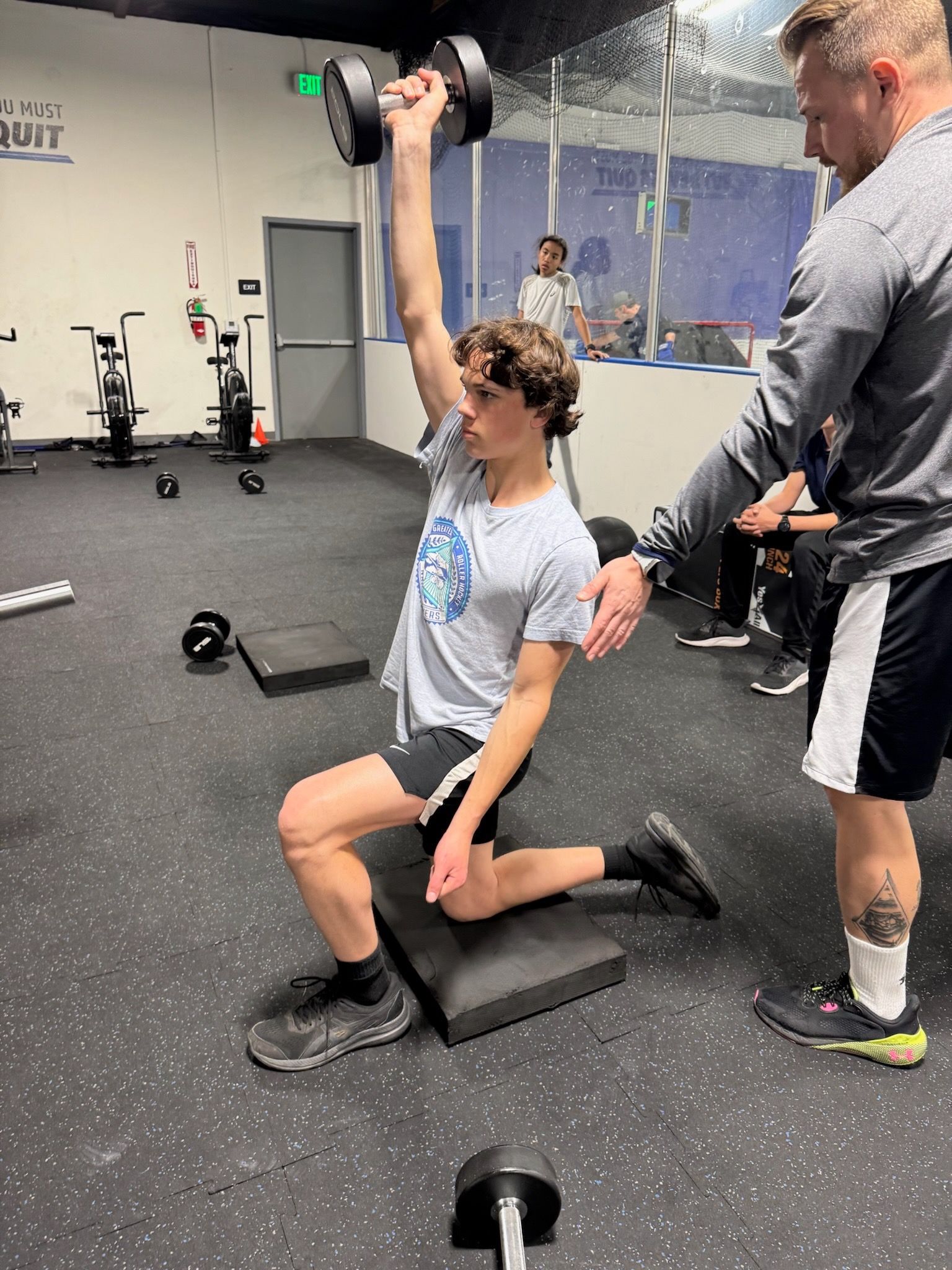 boy athlete exercising in the gym