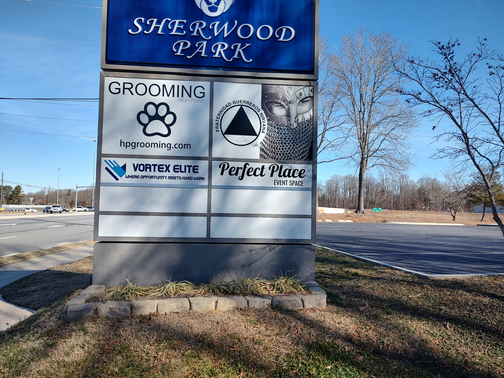 A sign for sherwood park grooming and perfect place