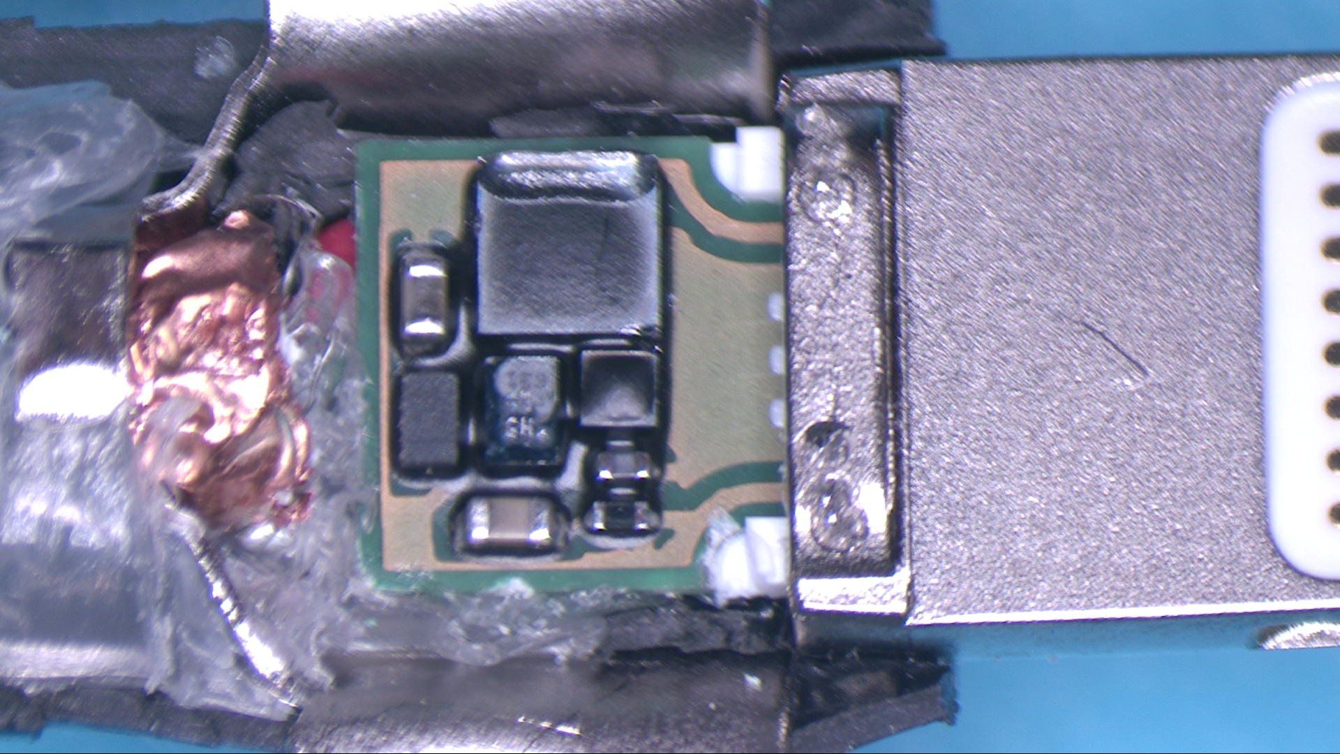 A close up of a motherboard in a charging cable.