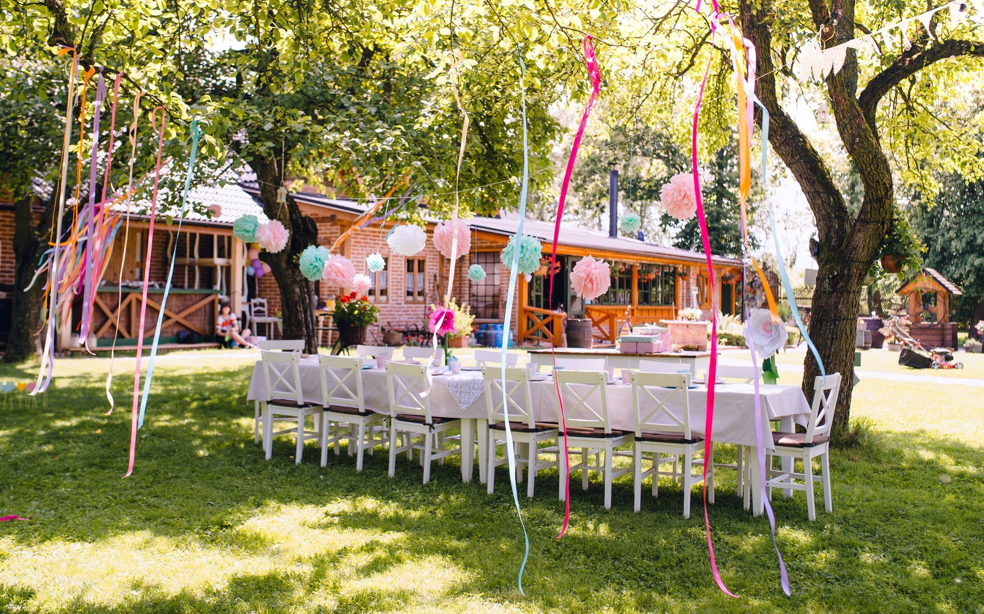 A long table and chairs are set up for a party.