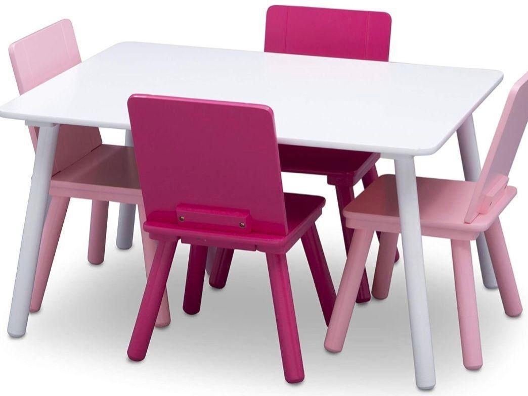 A table with four blue chairs on it