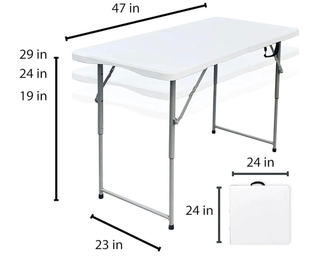 A white folding table with measurements on it