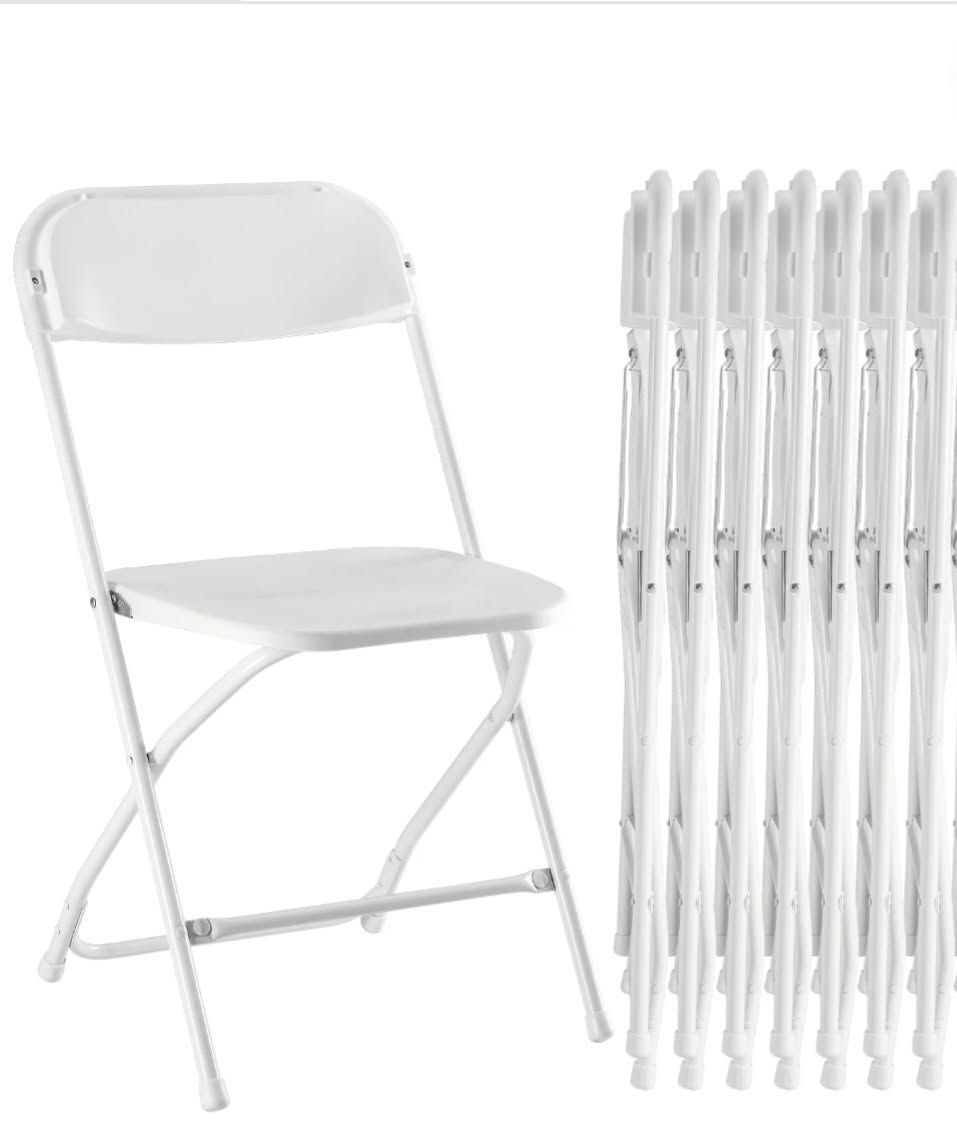 Two white folding chairs.