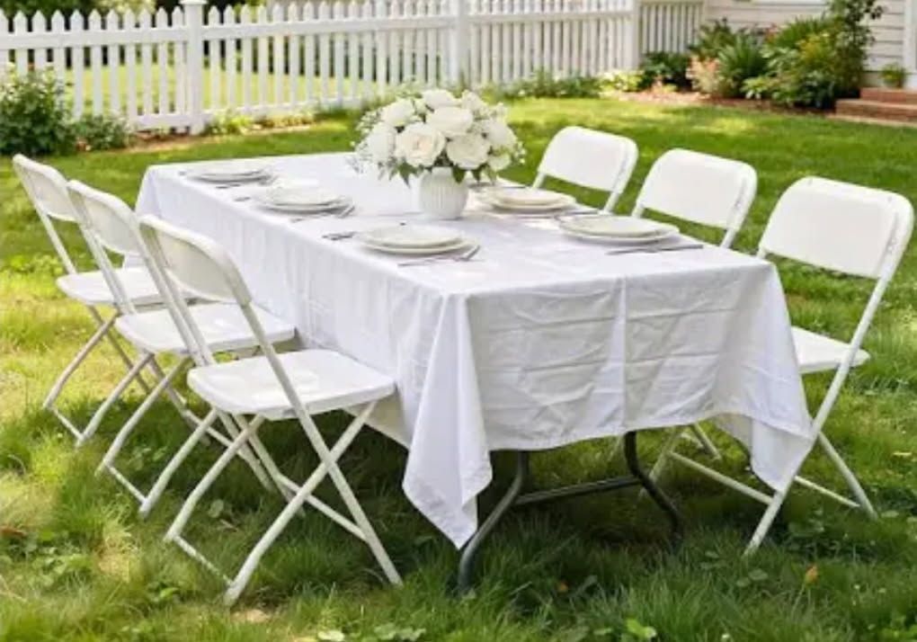 A white folding table with measurements on it