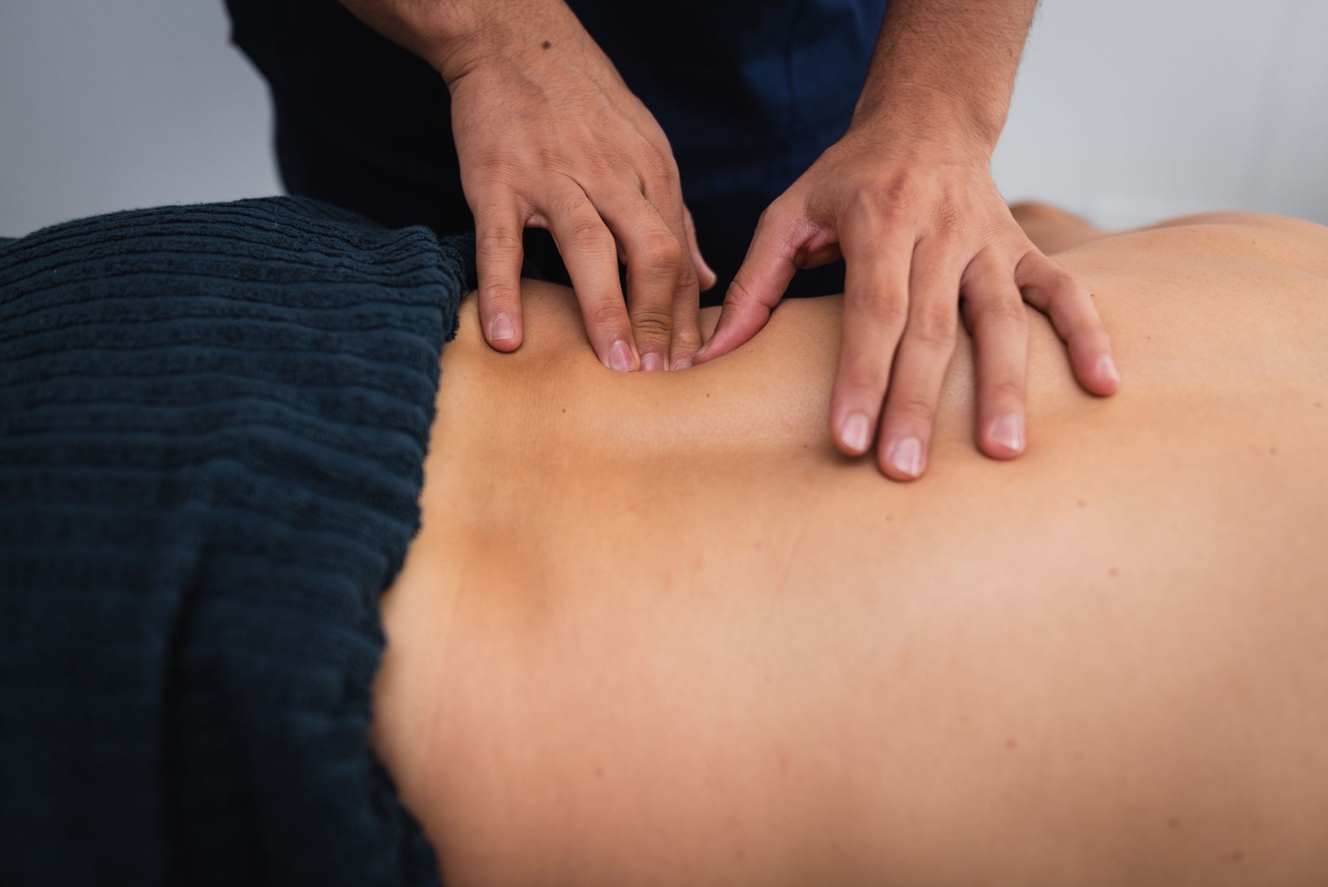 Chiropractor treating a patient's back.