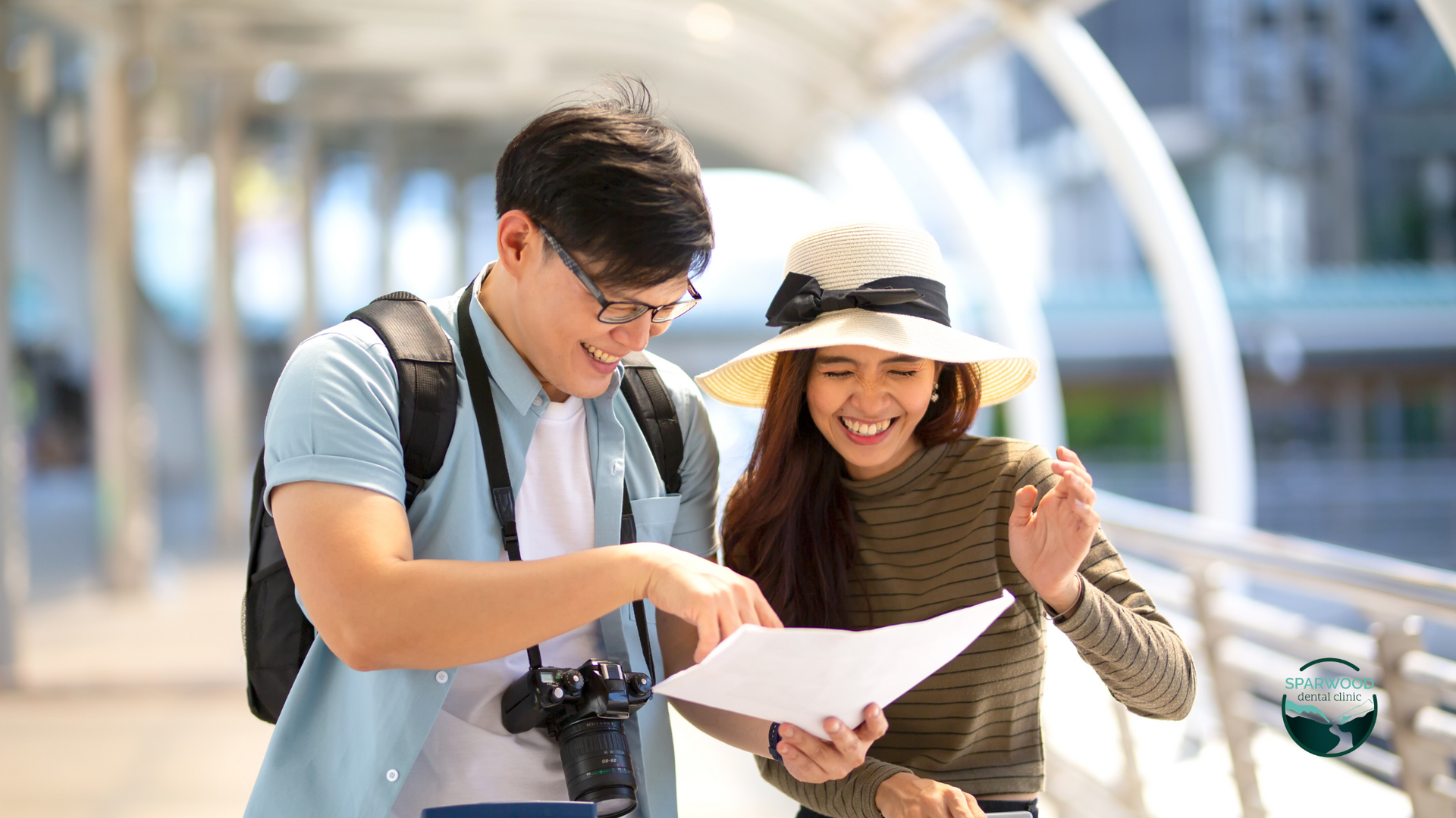 A man and a woman are looking at a map together.