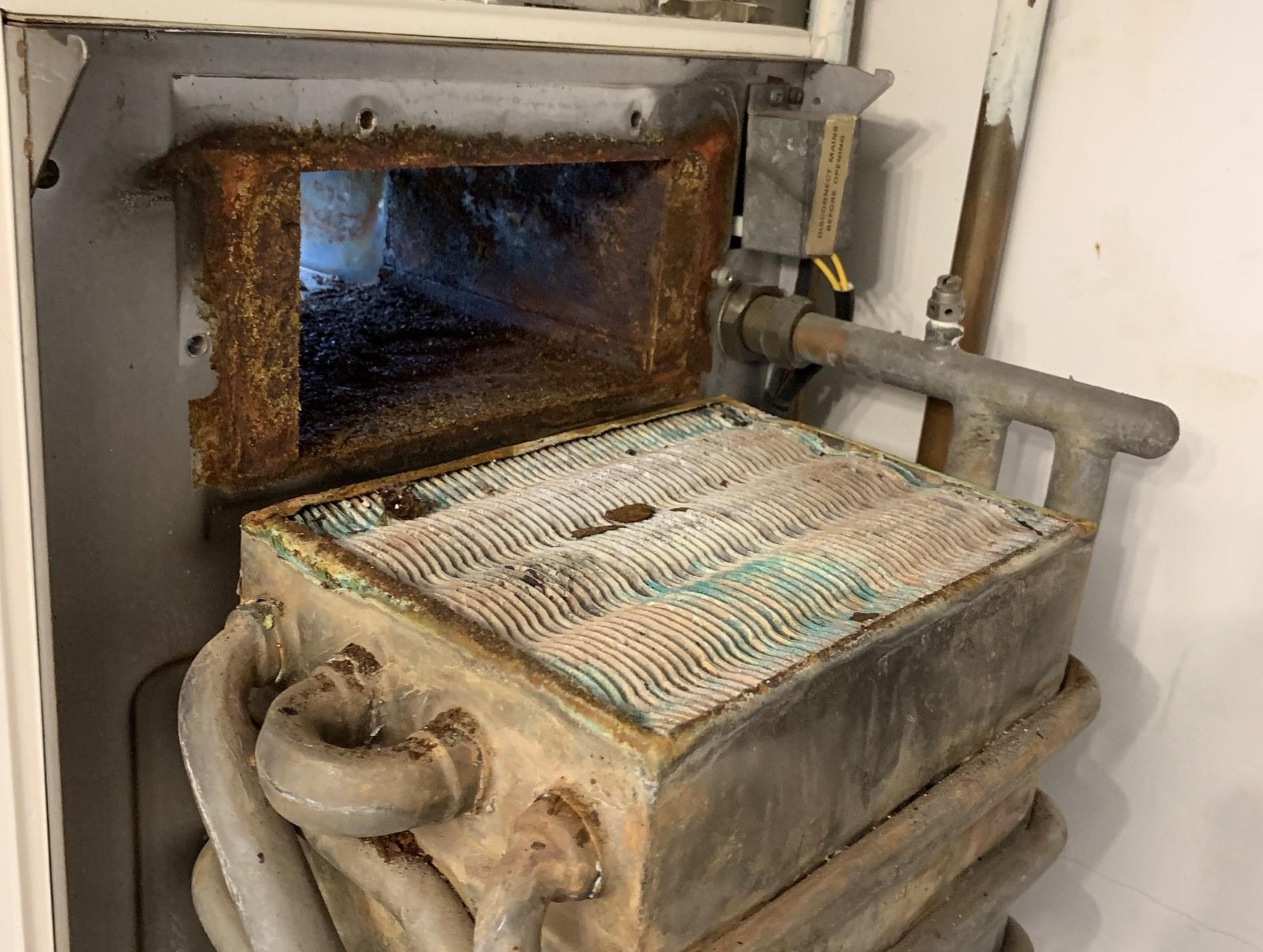 photo of an old and corroded boiler
