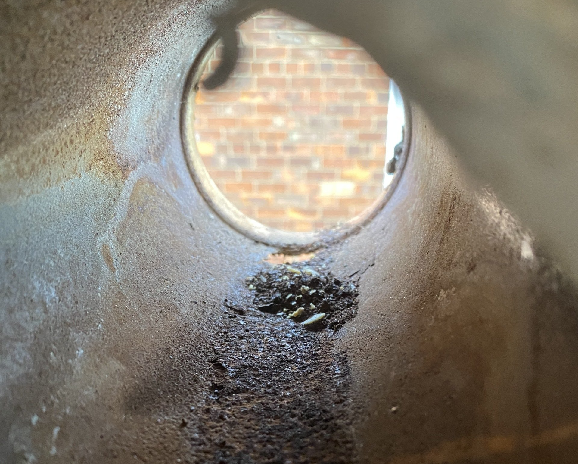 photo of a damaged boiler flue