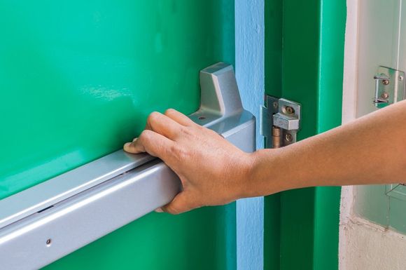 man opening fire door