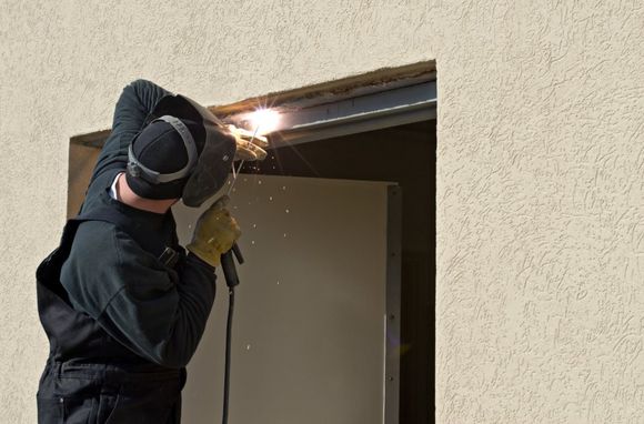 man fixing a door