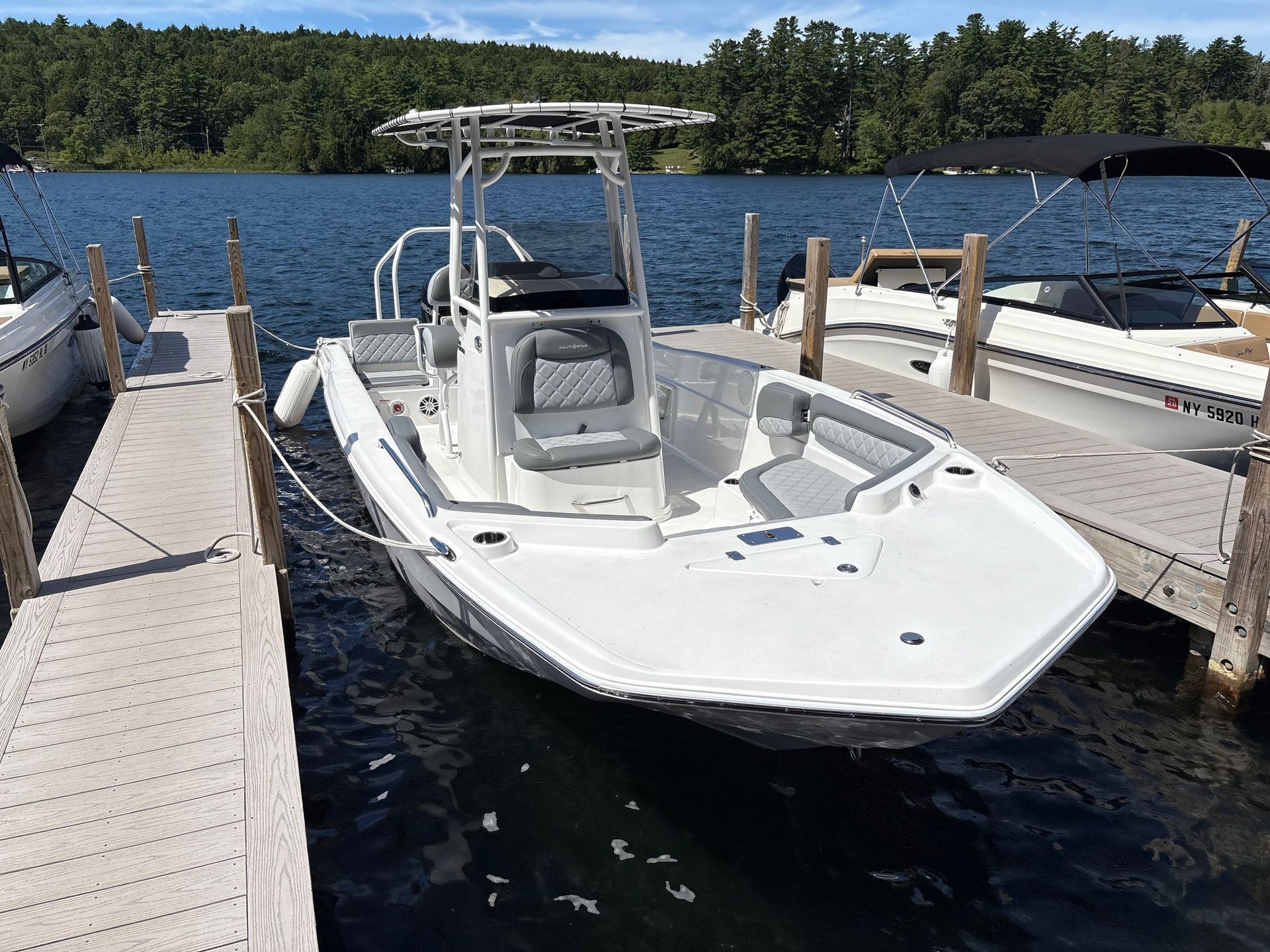 Nauticstar 231H tied to dock at Queen Boat co