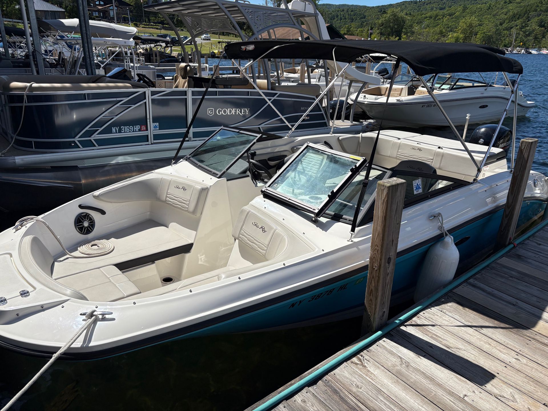 Sea Ray 210 tied to dock at Queen Boat Co