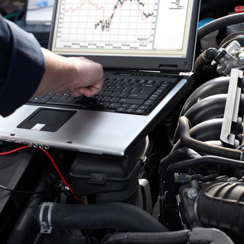 Professional car mechanic working in auto repair service