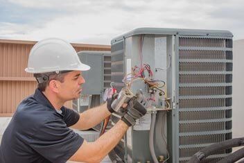 Technician Repairing Air Conditioner - Air Conditioning Services in Staten Island, NY