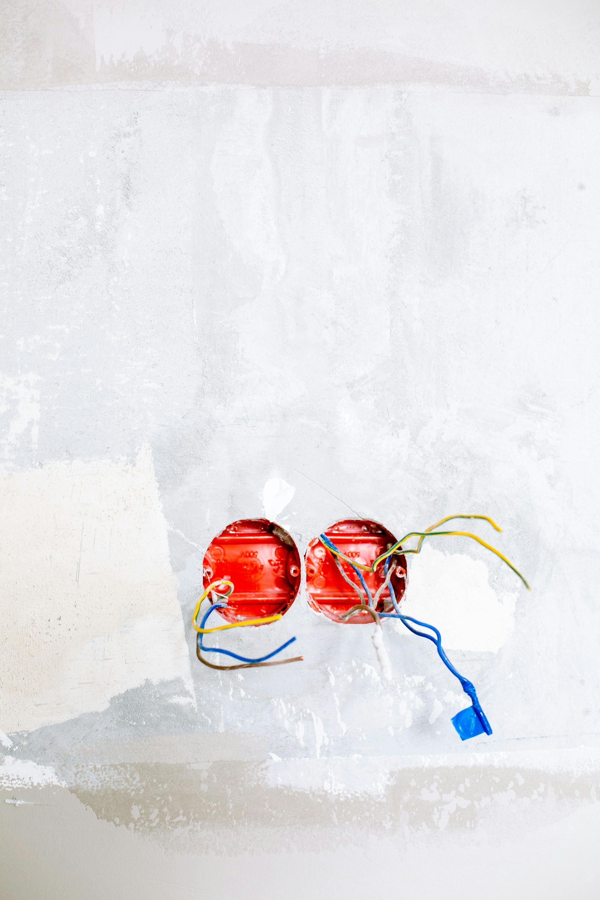 A room under construction with a table and scaffolding.