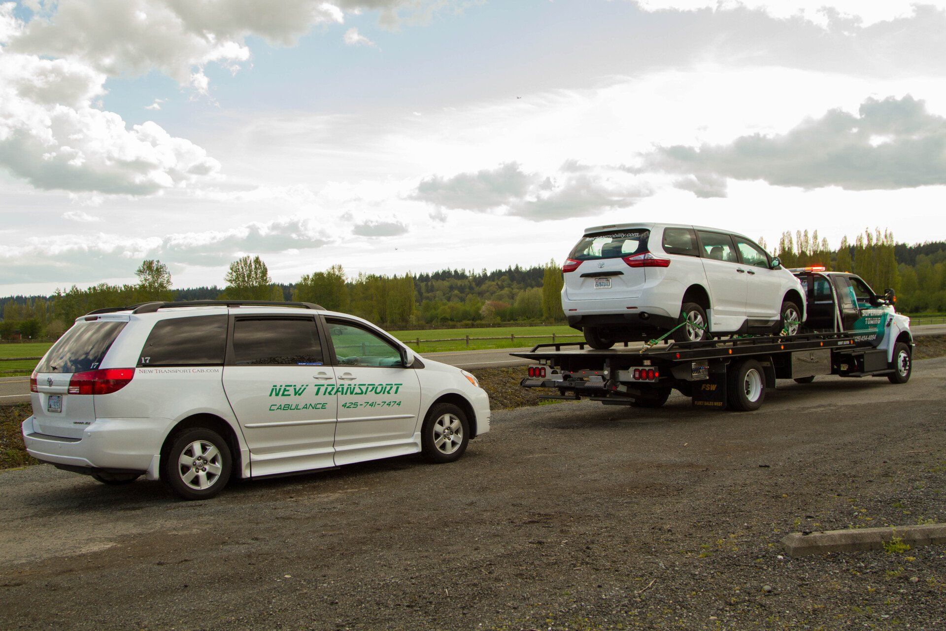 Car being towed with transport service from mobility roadside assistance