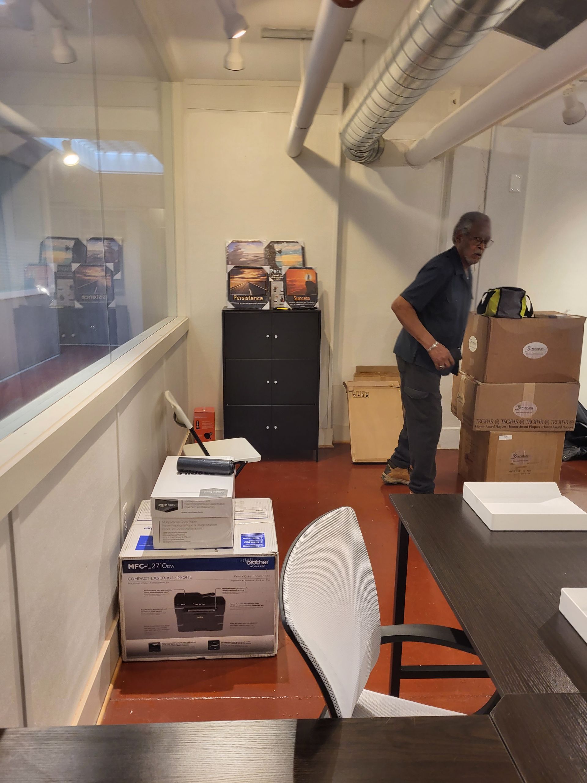 action photo of albert assembling office equipment