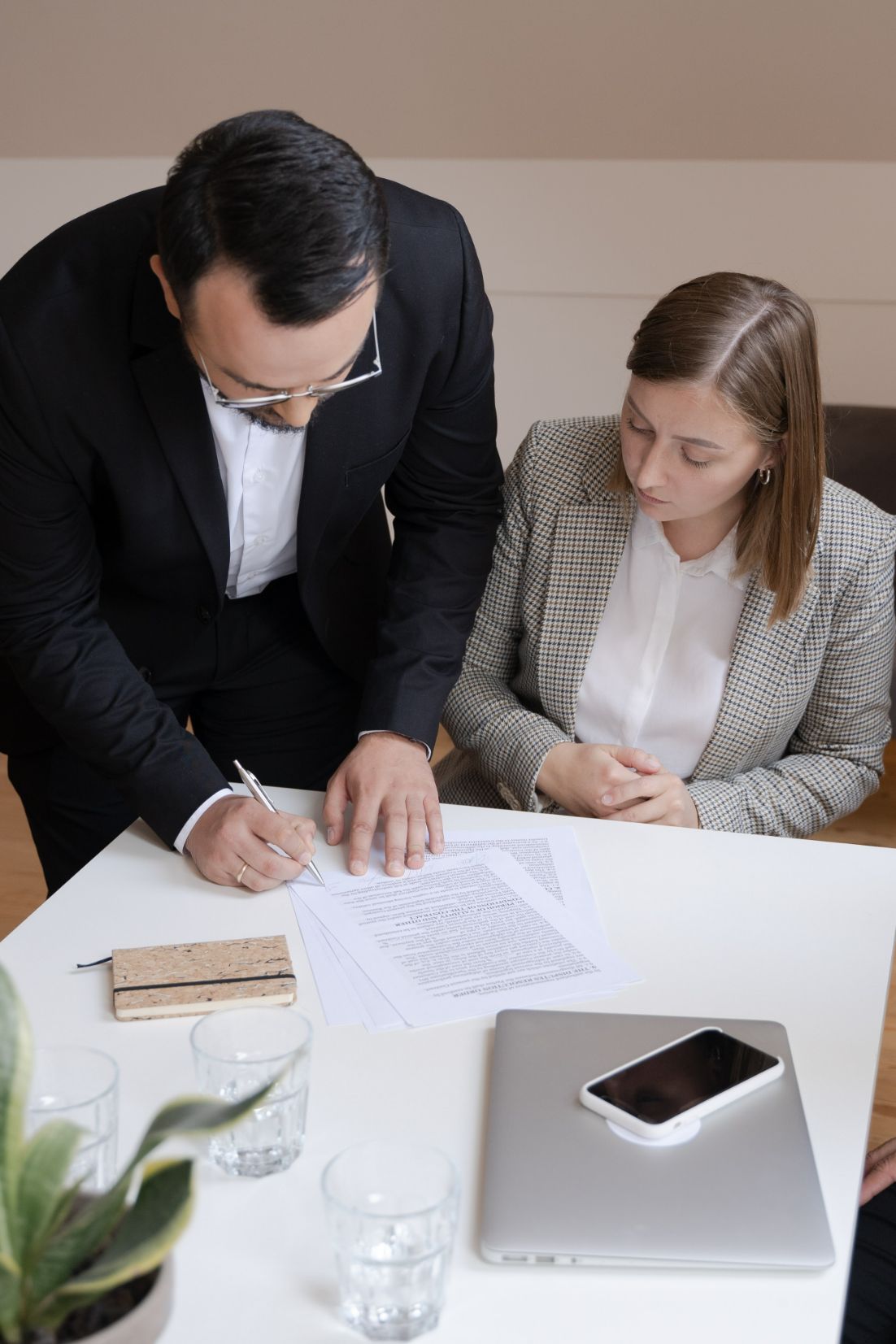 A Man in Black Suit Jacket Signing a Contract — All Finanz and Insurance Solutions PtyLtd in North Mackay, QLD