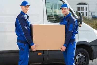 Home removal staff lifting box — All Removals in Port Macquarie, NSW