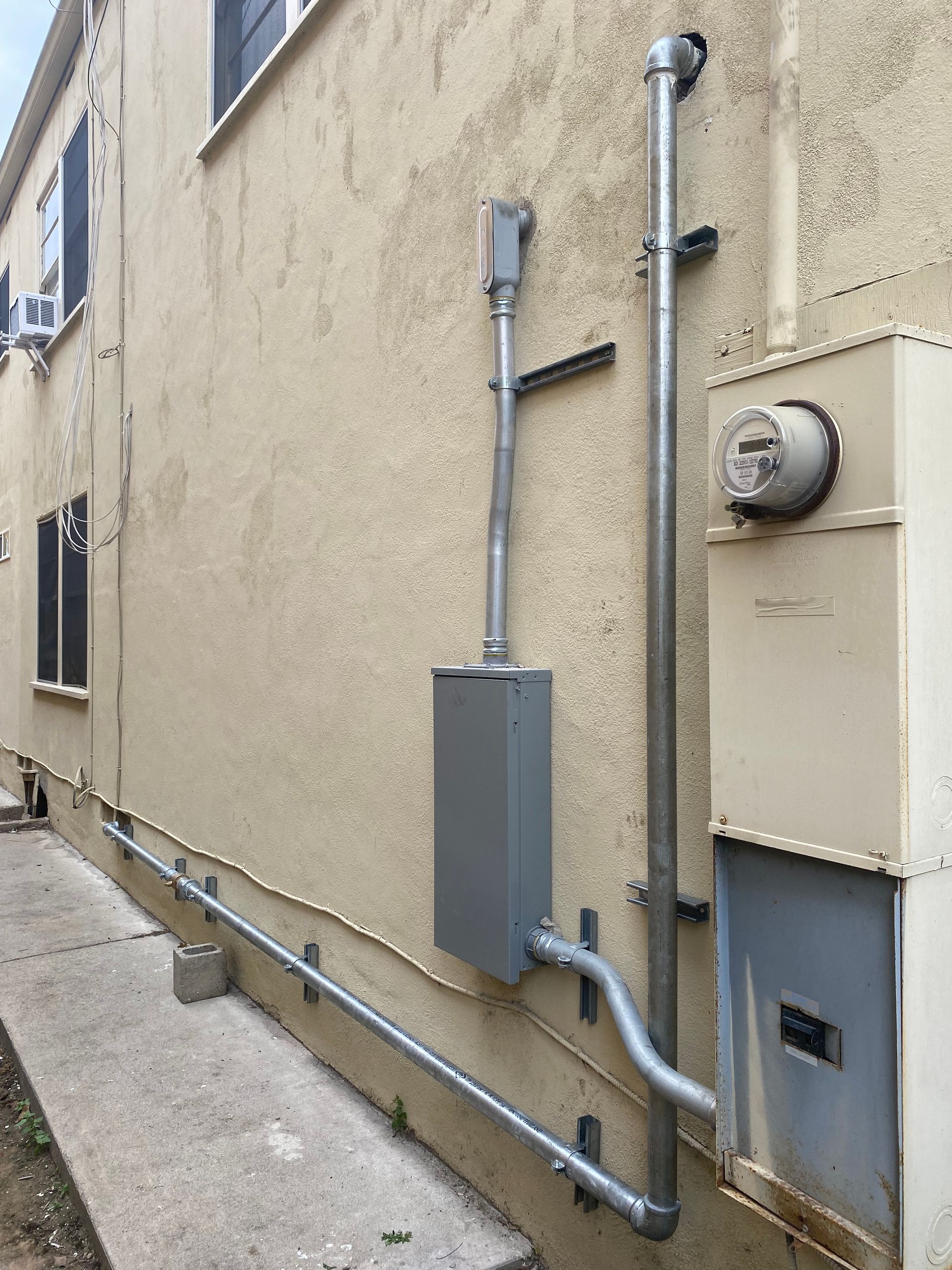 A building with a meter on the side of it