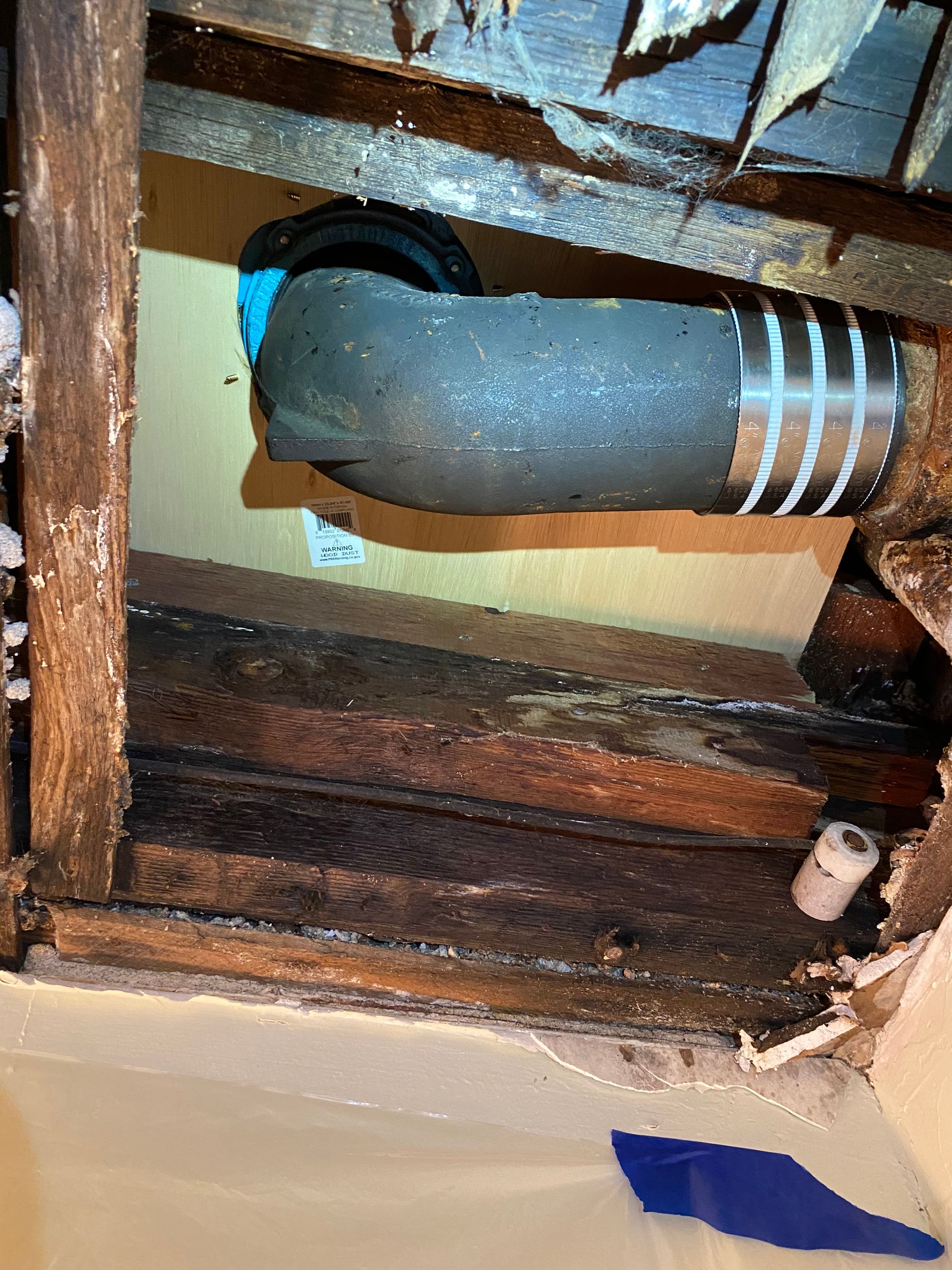 A close up of a pipe in a wooden frame.