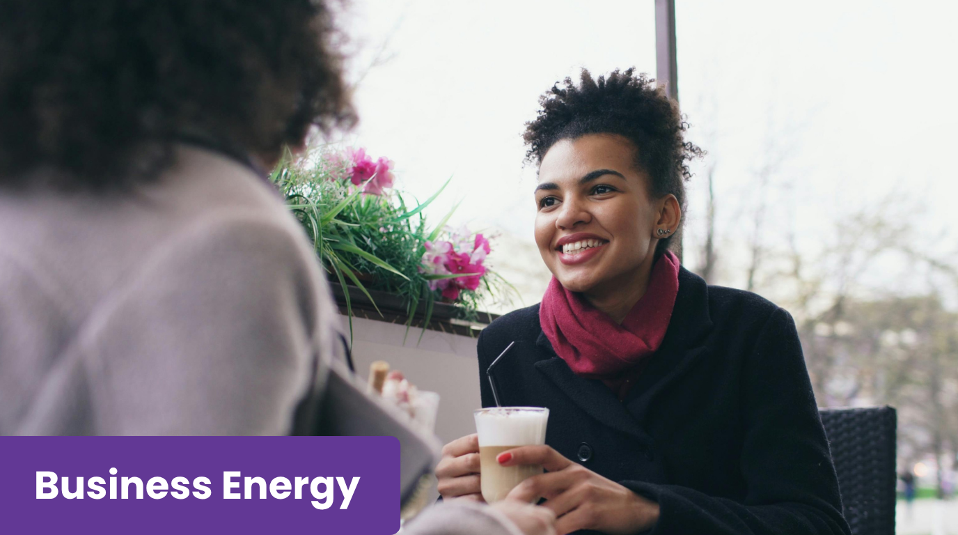 Women discussing energy business standing charges.