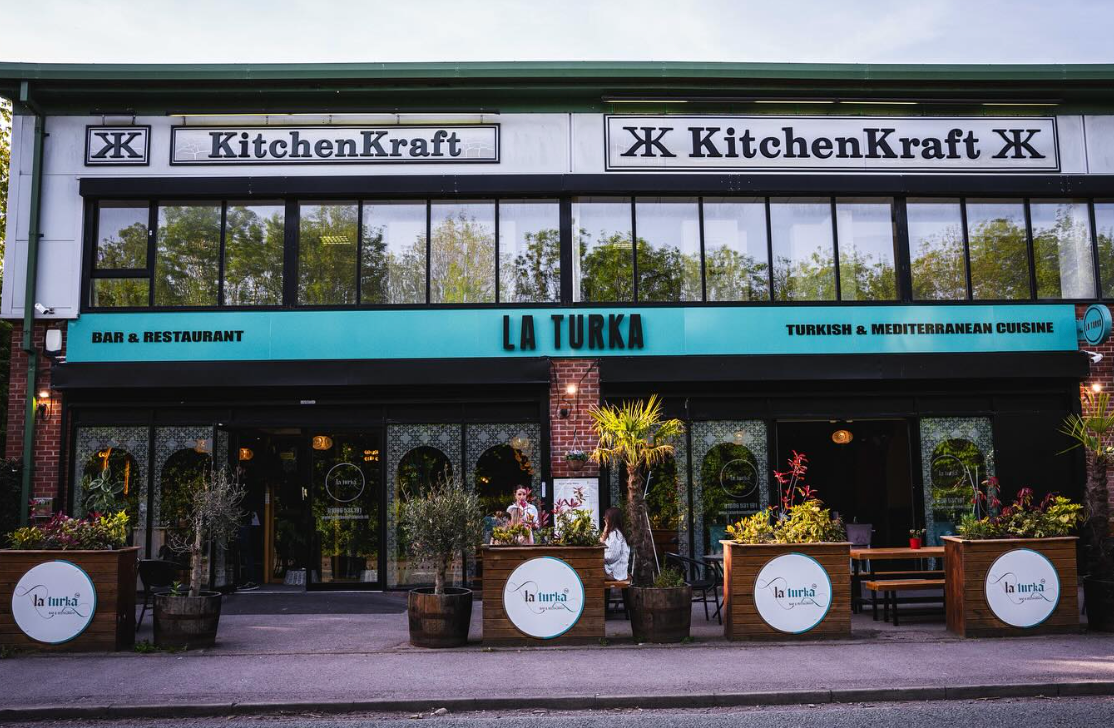 Typocolor case study cover photo of a colourful glass building. 